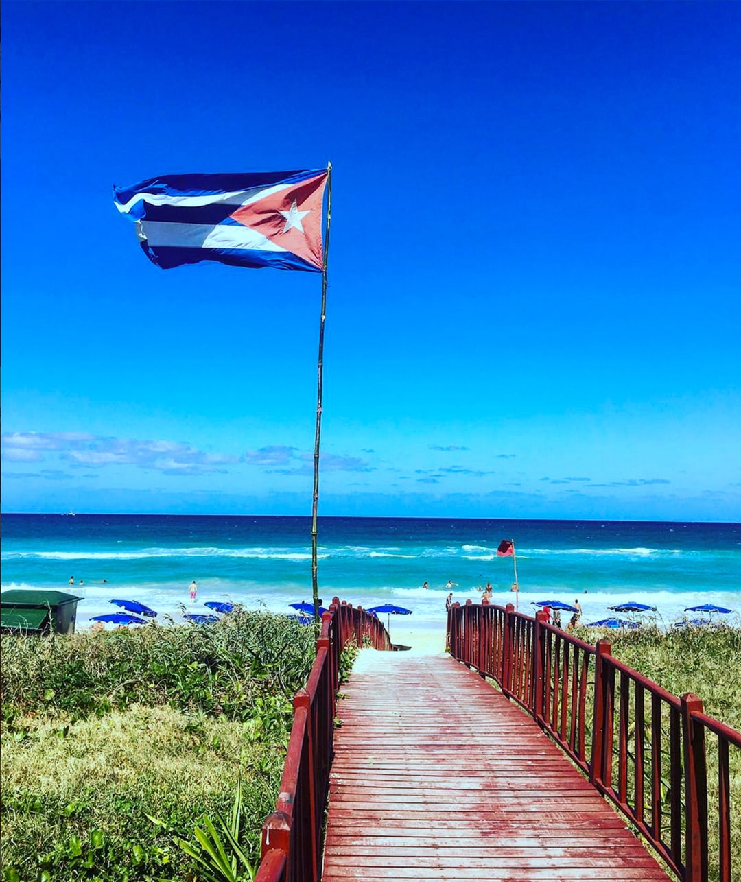 How to Travel to Cuba: Cuban Flag on Beach