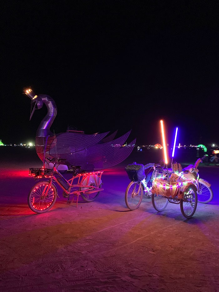 10 Principles of Burning Man - neon bikes at night on the playa