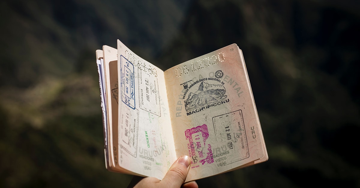 Person Holding Open Passport