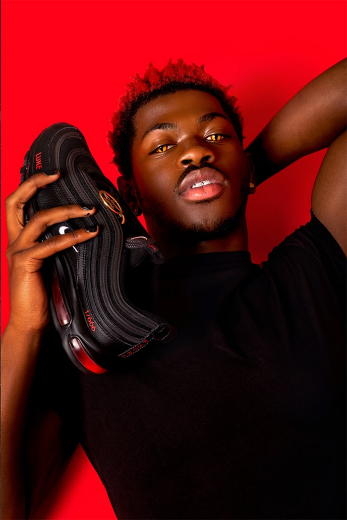 Lil Nas X holdingLil Nas X holding Satan Shoes Satan Shoe