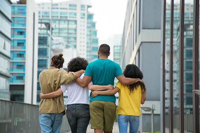 What Is Polyamory Types - Four people walking arm in arm