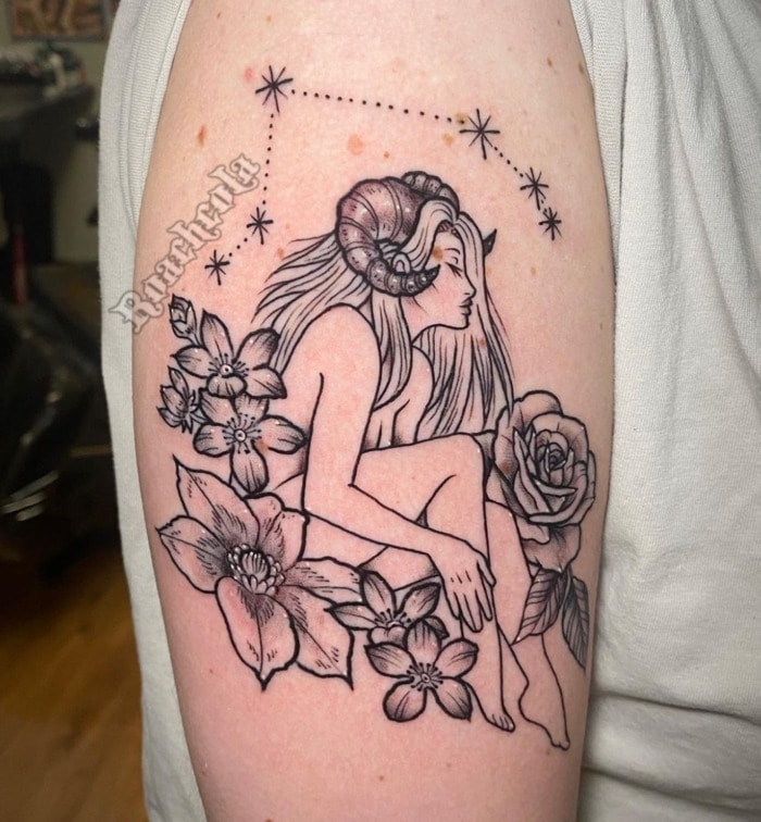 Aries Tattoo - woman with ram horns in flowers