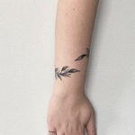 Wrist Tattoos - wraparound leafy tattoo