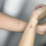 Small Wrist Tattoos - freckle smiley face