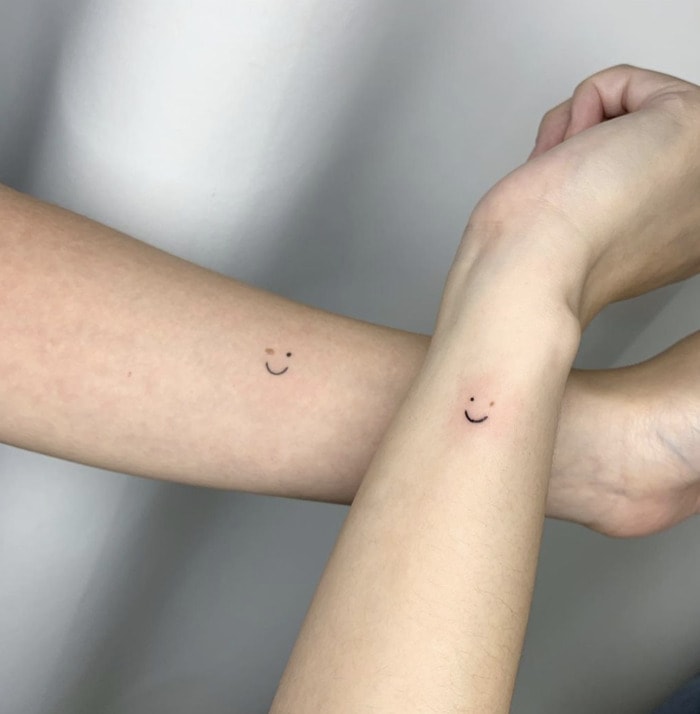 Small Wrist Tattoos - freckle smiley face