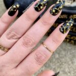 Black Nails - Gold Stars and Moons With a Black Base