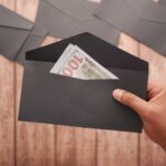 How To Save Money - dividing cash into envelopes