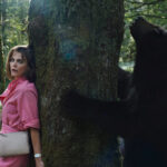 Cocaine Bear Facts - movie still of bear and actress