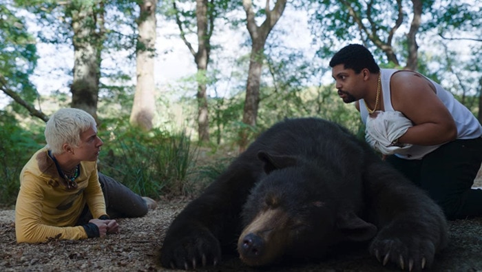 Cocaine Bear Facts - movie still of actors with bear