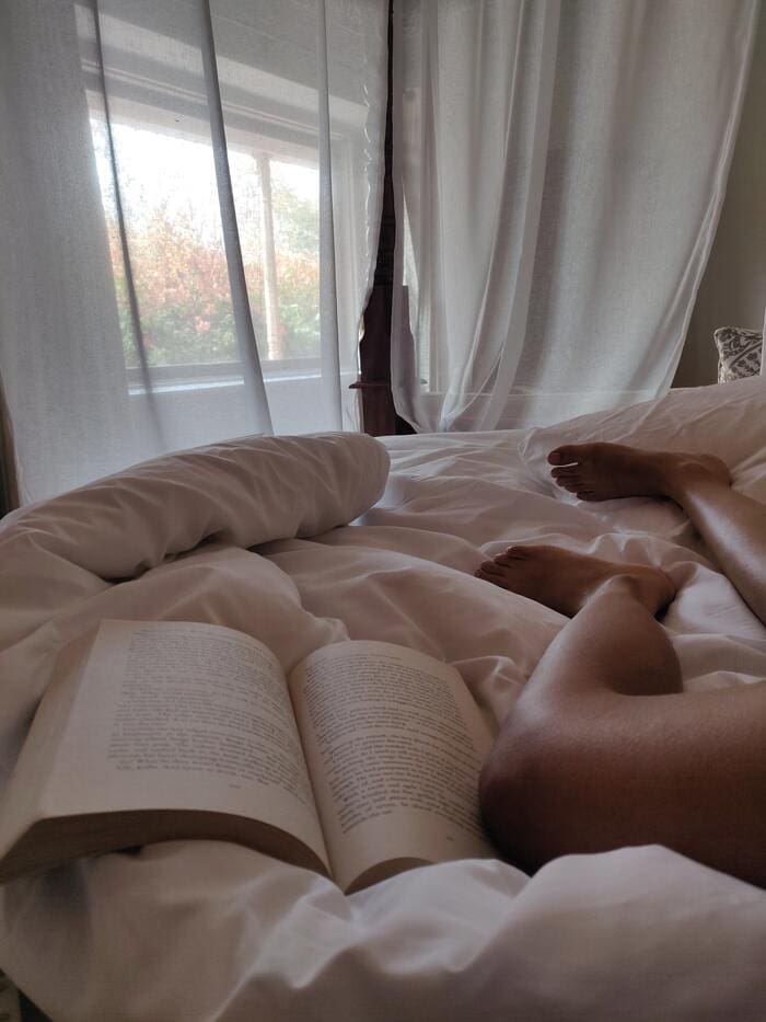 Best literotica- woman reading in bed