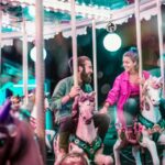 Questions to Ask a Guy - man and woman on carousel