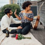 what to ask before you move in together - couple on picnic