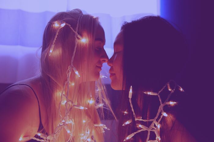what to ask before you move in together - lesbian couple before a kiss