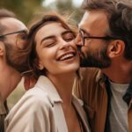 best LGBTQ dating apps - Polyamorous people, Smiling young woman living in a Polyamorous relationship with two men, posing at a park
