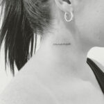 micro tattoos - lettering on neck