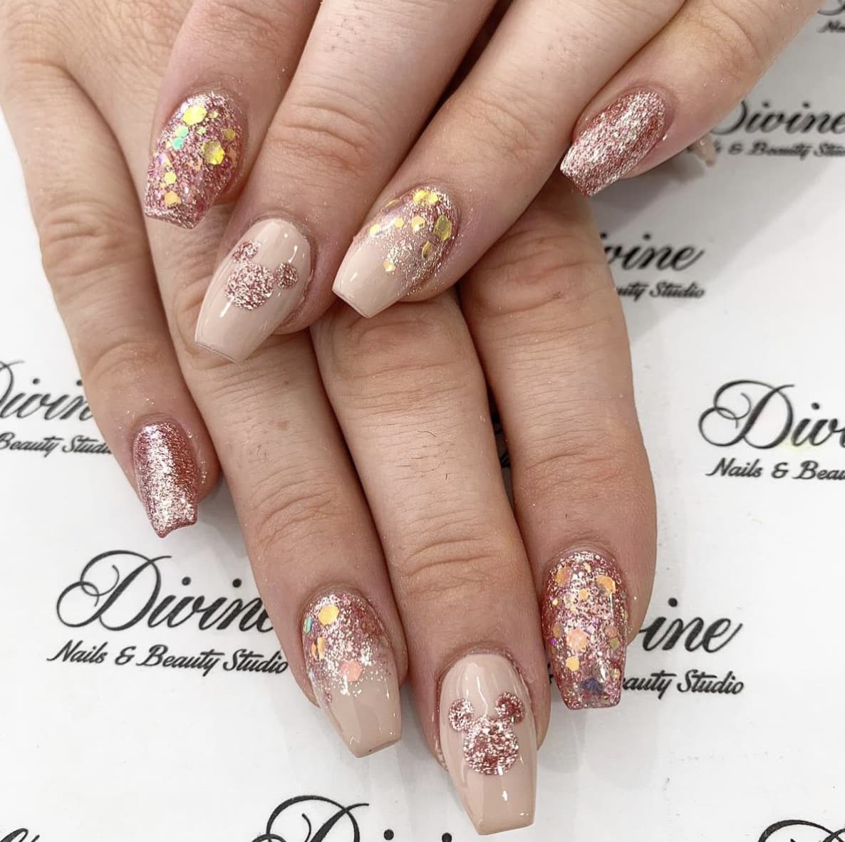 disney nail designs - sparkly rose gold polish with subtle mickey ears