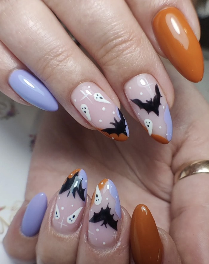 fall nail designs 2023 - lavender and orange with black bats and ghosts