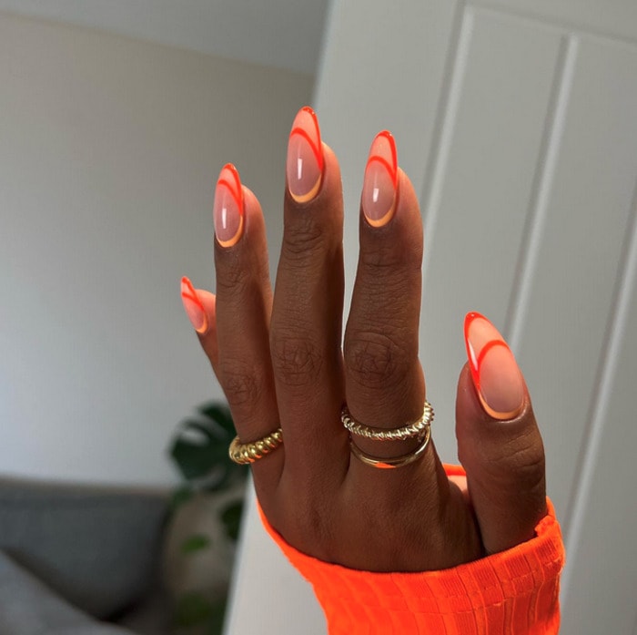 fall nail design ideas 2023 - neon orange negative space