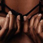 bra size chart - woman unclasping bra