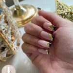 December Nail Designs 2023 - Add gold and black to nude nails
