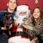 Funny Christmas Photos - cat and dog fighting in front of Santa