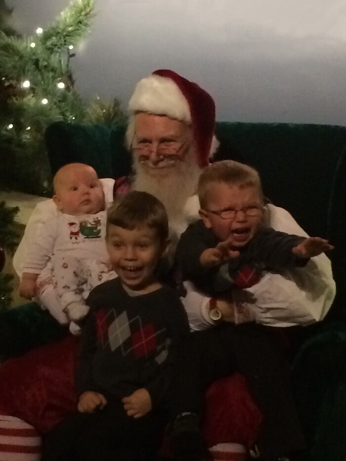 Funny Christmas Photos - kids with different expression beside Santa