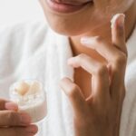Winter Skincare Tips - lady applying skin care product on her face
