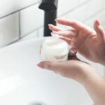 Winter Skincare Tips - woman getting moisturizer