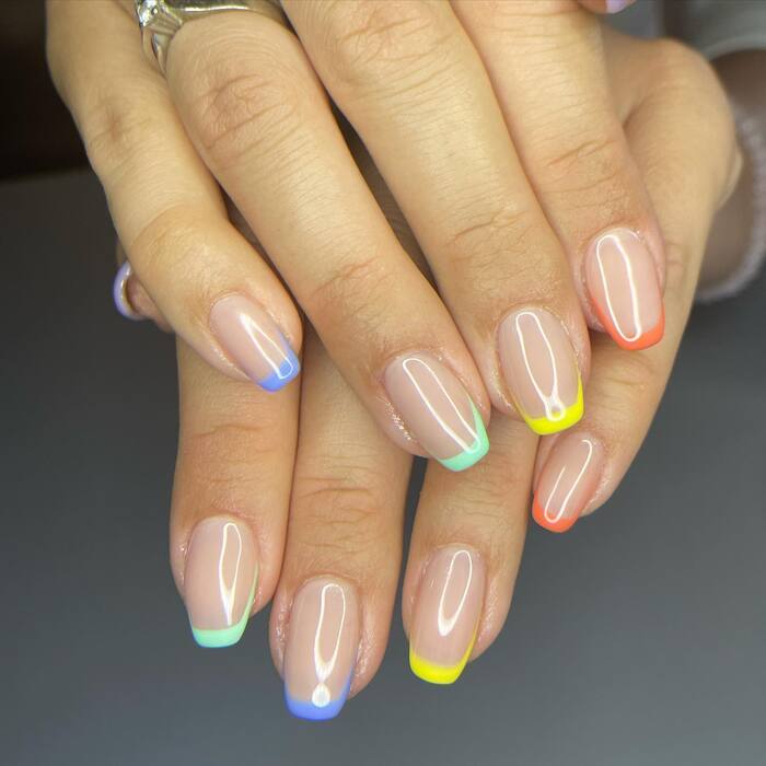 2024 Nail Trends - Pair a nude nail with colorful French tips.